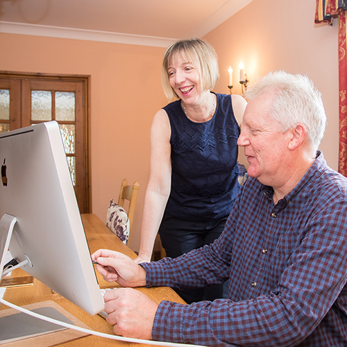 Pam Allen and a client at their home office in Crewe, Cheshire