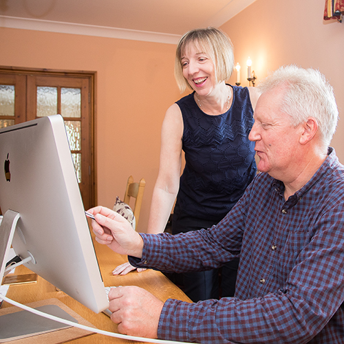 Pam Allen and a client at their home office in Crewe, Cheshire